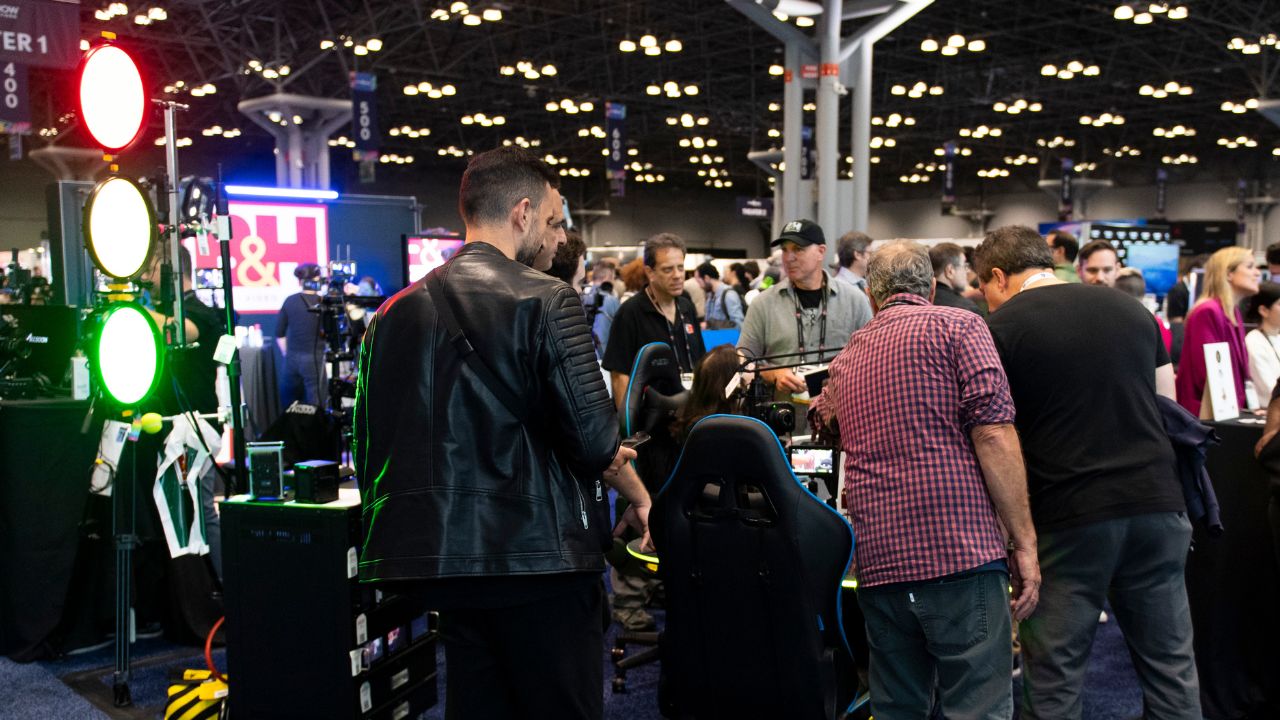 People crowd the show floor at NAB Show New York, interacting with exhibitors