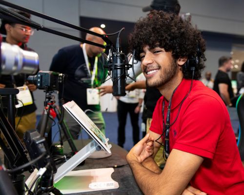 NAB Show New York participant is testing out radio gear on the show floor