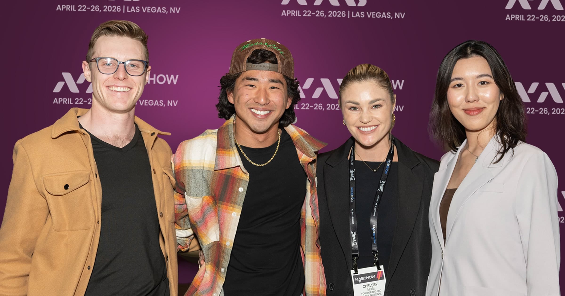 Image of four creators standing in a row.