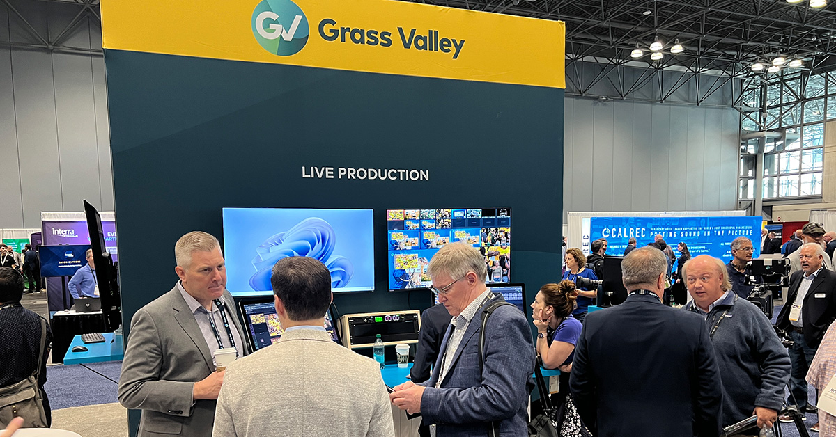 Grass Valley Exhibits at NAB Show New York. Nearly a dozen attendees are at their booth on-site.