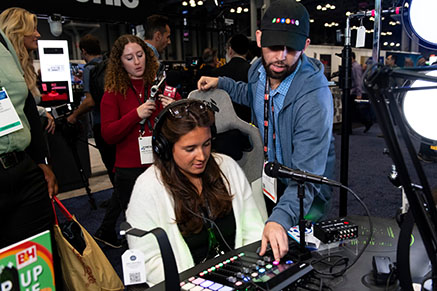 NAB Show New York attendee getting hands-on with products on the show floor