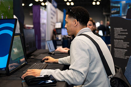 NAB Show New York attendee getting hands-on with products on the show floor